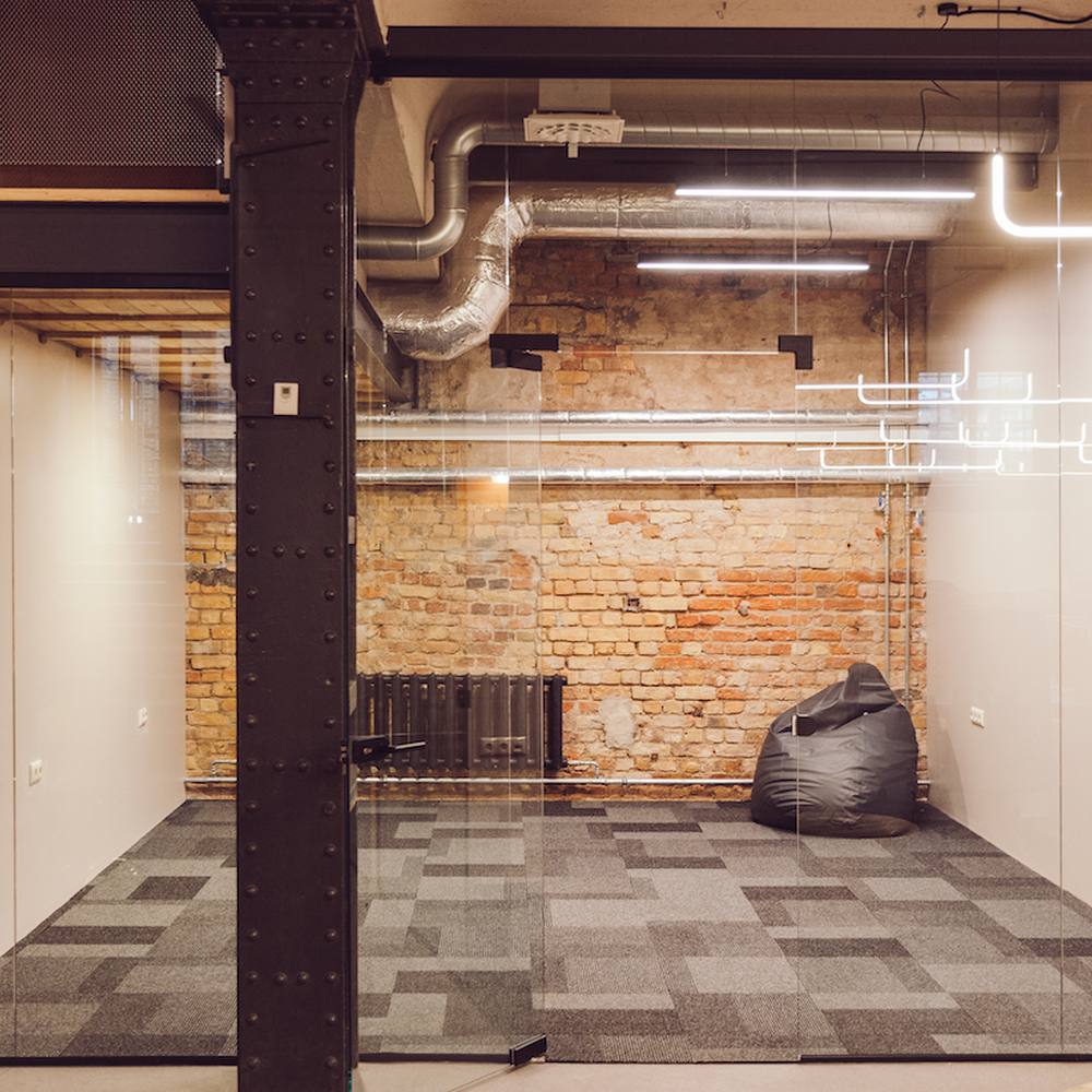 Private glass-walled offices at Double9 Riga